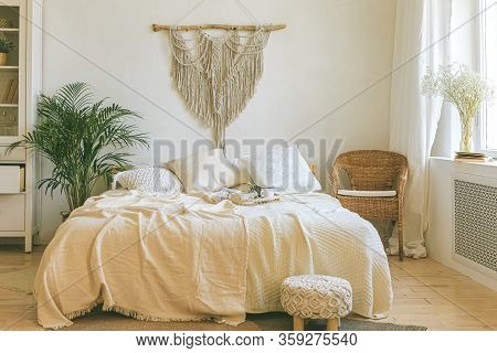 Modern Romantic Scandi Boho Style Bedroom Interior With Decorative Pillows, Green Plant, Diy Macrame