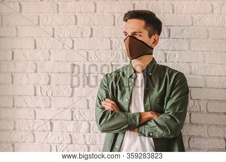Confident Young Man In Stylish Shirt In Respirator Or Face Mask. Professional Pesonal Protection Fro