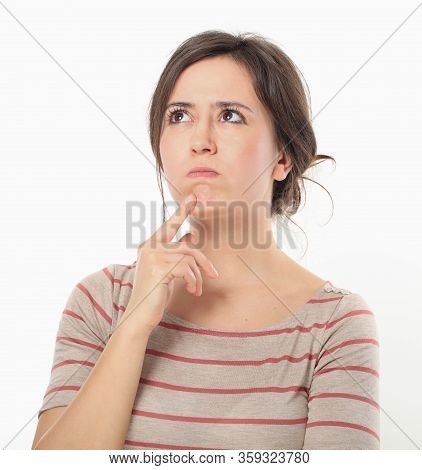Nice Woman Looking Upwards And Holding Her Bread