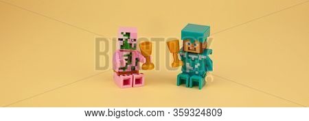 Ukraine, Kyiv - April 3, 2020: Lego Figures Stay At Home And Drink From Glasses. Minecraft Little Me
