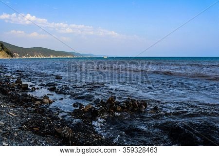 relax on the beach of the resort town with a beautiful view of the mountains. Black sea, Betta, Gelendzhik