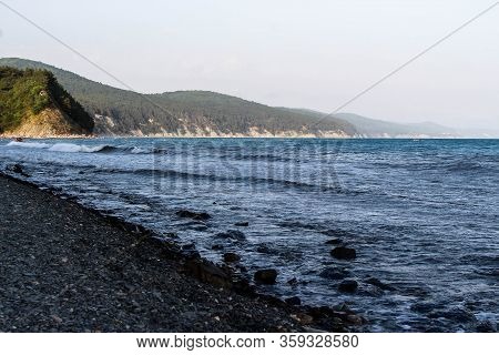 relax on the beach of the resort town with beautiful mountain views. Betta, Gelendzhik. Black sea coast