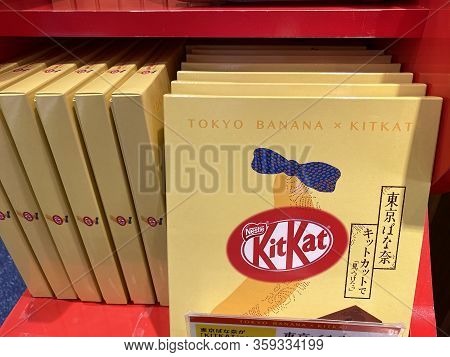 Toyko, Japan - March 30, 2020: Shelf Display With Tokyo Banana Kit Kats Candy Bars On Sale, In A Gif