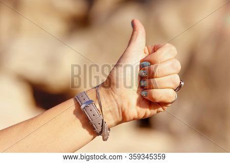 Women Thumb Up On The Background Of Pyramids Of Cappadocia