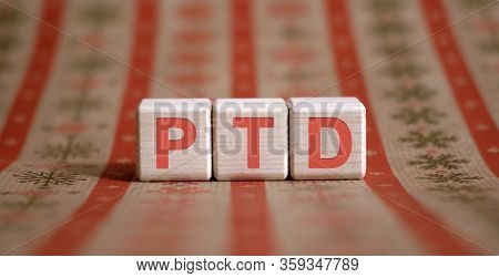 Ptd - Project To Date Acronym - Financial Business Concept. Wooden Cubes On A Color Table.