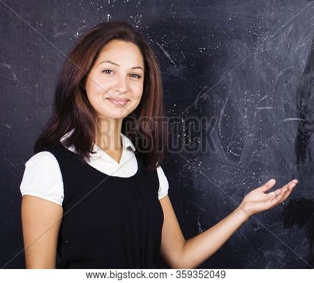 Little Cute Boy In Glasses With Young Real Teacher, Classroom Studying At Blackboard School Kido