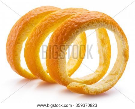 Orange peel or orange twist on white background. Close-up.