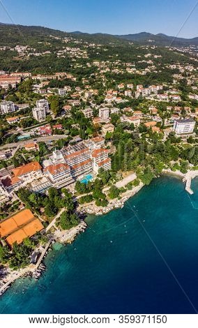 Beautiful panoramic view of Lovran village and its sea shore in Croatia. Top view photo taken on drone.