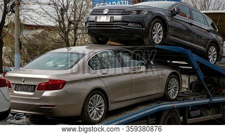 Bucharest, Romania - March 02, 2020: A Bmw 520d Car And A Volkswagen Passat B8 Highline Variant Are 