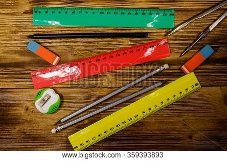 Set Of School Stationery Supplies On Wooden Desk. Top View