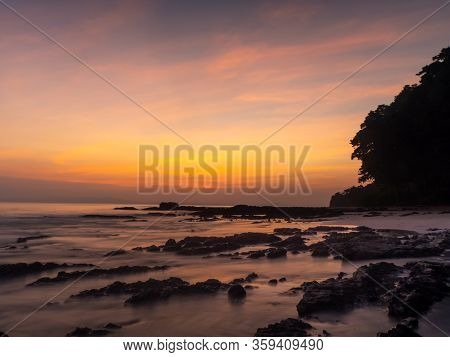 Beautiful, Dramatic And Moody Sunset On The Rocky Part Of The Radhanagar Beach In The Havelock Islan