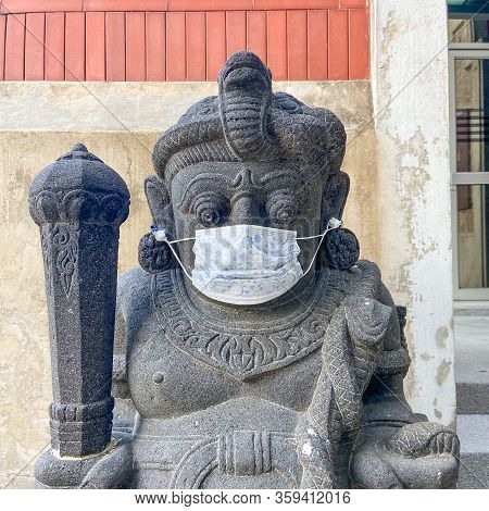 A Javanese-style Dvarapala Or Door-guardian Wearing A Face Mask. Dvarapalas Are Common At Entrances 