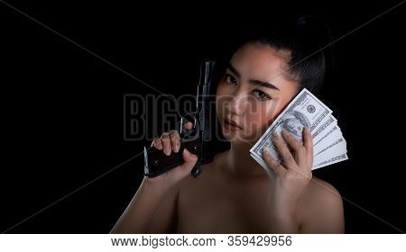 Portrait Beautiful Asia Woman One Hand Holding A Gun And Money Banknote 100 Dsd At Black Background,