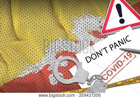 Bhutan Flag And Police Handcuffs With Inscription Dont Panic On White Paper. Coronavirus Or 2019-nco