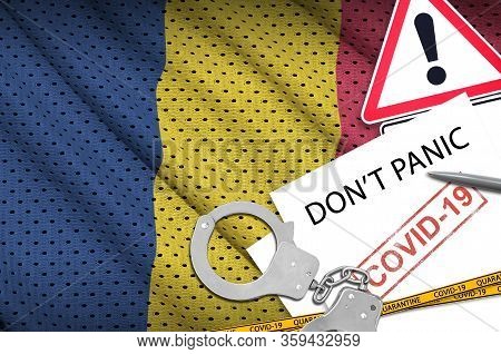 Chad Flag And Police Handcuffs With Inscription Dont Panic On White Paper. Coronavirus Or 2019-ncov 