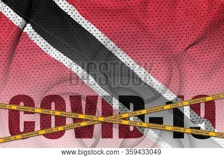 Trinidad And Tobago Flag And Covid-19 Inscription With Orange Quarantine Border Tape. Coronavirus Or