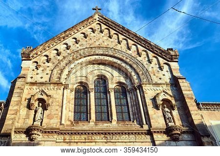 A Fragment Of The Stone Facade Of The Medieval Church Of The City Of Aubenas In France