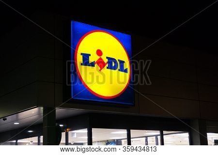 Prague, Czech Republic - April 3 2020: Lidl Company Logos At Night On Supermarket Building From Germ