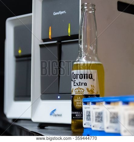 Corona Beer In Front Of Cepheid Genexpert Polymerase Chain Reaction (pcr) Test Machine