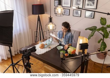 Nurse Making Video About Introducing Soft Food To Baby Nutrition And Preparing Fresh Fruit And Veget