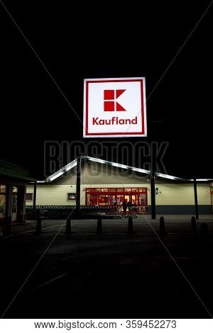 Prague, Czech Republic - April 3 2020: Kaufland Company Logo At Night On Supermarket Building From G