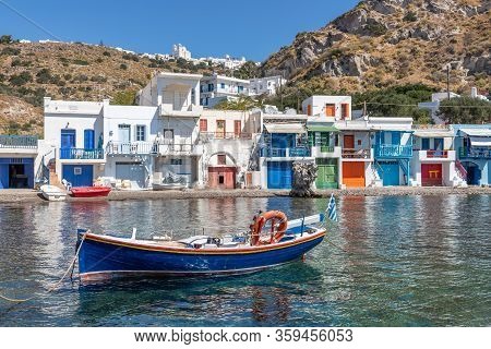 Boat Coloured Houses In Klima Beach With Trypiti Village In Background