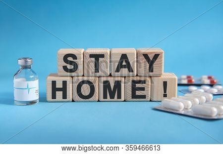Stay Home - Medicine Concept - Text On Cubes. Drug In Ambula, Tablets In Blisters To Reduce Disease 