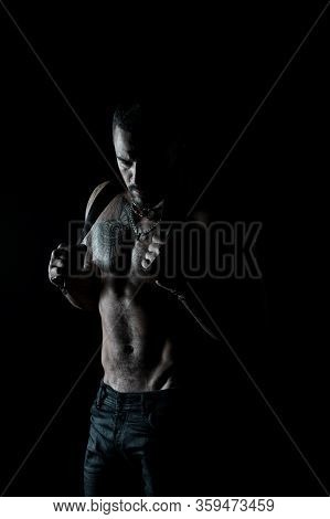 Man Silhouette Hold Leather Belt. Fashion Portrait Of Strong Guy In Dark. Desire And Seduction. Hand