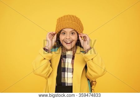 Winter Hat Accessory. Girl Long Hair Yellow Background. Cold Season Concept. Winter Fashion Accessor