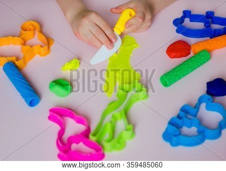 Child Hands Playing With Colorful Clay. Homemade Plastiline. Girl Molding Modeling Clay. Homemade Cl