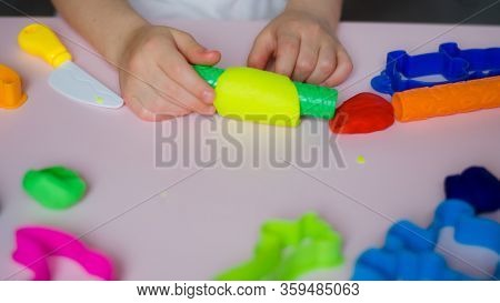 Child Hands Playing With Colorful Clay. Homemade Plastiline. Girl Molding Modeling Clay. Homemade Cl
