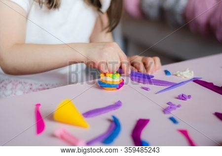 Child Hands Playing With Colorful Clay. Homemade Plastiline. Girl Molding Modeling Clay. Homemade Cl