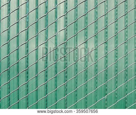 Green Pattern Of Vertically Oriented Stripes Of Plastic Woven With Obliquely Oriented Wire -texture 
