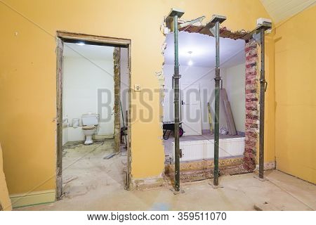 New Wall Opening Supported By Props After Removing An Internal Brick Wall In A Uk Home