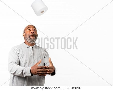 African American Man With Toilet Paper During Corona Virus Crisis. Dark Humor With Copy Spacc