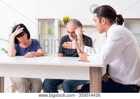 Financial advisor giving retirement advice to old couple