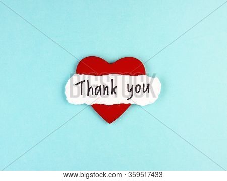 Healthy Red Heart And The Inscription Thank You On A Blue Background. Concept Of Gratitude To Medica