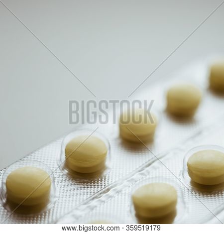 Blister With Yellow Pills Or Vitamins Closeup, Side View.