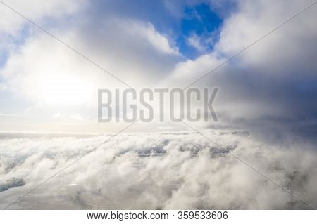 Aerial View Clouds Over Forest. Aerial View Of Forest And Clouds. Aerial Drone View Flying Over The