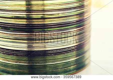 Lot Of Old Cds Stacked On The Windowsill