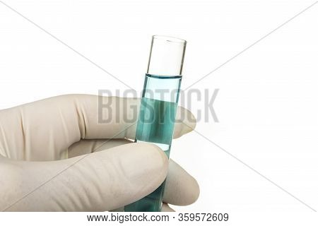 Hand In Glove Holding Test Tube With Liqiud