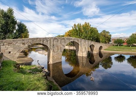 Navaluenga, Spain. View Of Stone Roman Bridge (puente Romanico) Over Alberche River