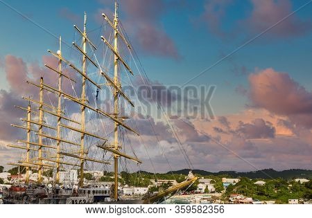 A Five Masted Schooner In A Tropical Port