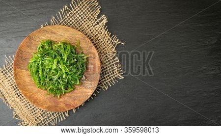 Chukka Seaweed Salad Or Sea Kelp Salat On Rustic Background