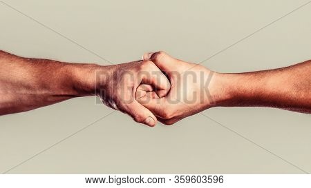 Rescue, Helping Hand. Male Hand United In Handshake. Man Help Hands, Guardianship, Protection. Two H