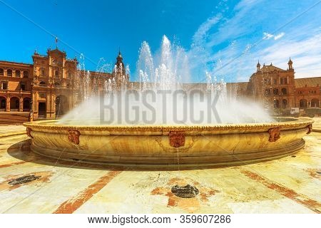 Central Fountain Of Plaza De Espana In Seville With Renaissance Building Consisting Of Arches And Co
