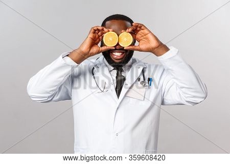 Healthcare, Healthy Diet And Disease Concept. Happy Funny African-american Male Doctor In White Coat