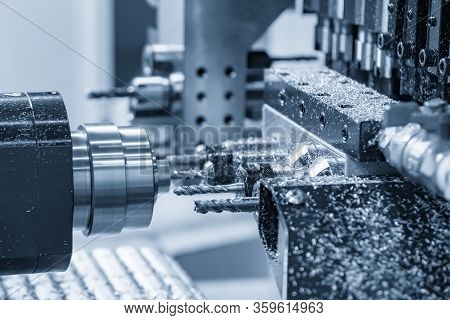The  Multi-tasking Cnc Lathe Machine Making The Thread At The Brass  Shaft Parts With Tapping Tool. 