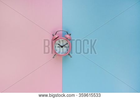 Ringing Twin Bell Vintage Alarm Clock Isolated On Pink And Blue Background With Copy Space. Rest Hou