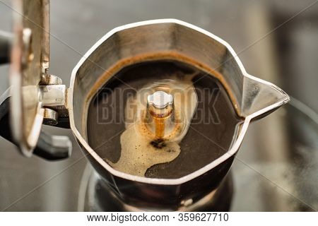 Making Tasty Black Coffee In Metal Moka Pot On Electric Cooker Close Up Detail